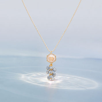 Gold Finish Chain With Peach Crystal Pendant And Silver Grey Crystal Drops. The Delicate Yet Power Packed Design Is a Subtle Statement To Your Summer Look