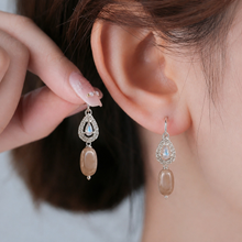 Hook Earings In Zercon With Silver Rhodium Finish With Peach Moonstone Drop